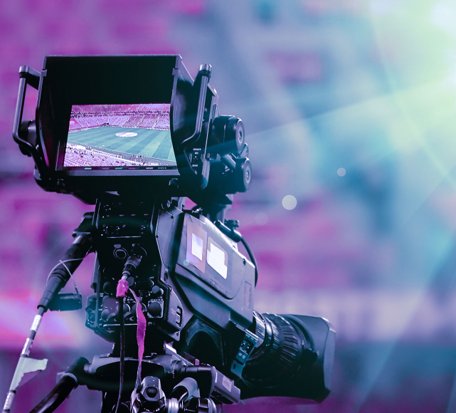 Photo of a camera filming an event