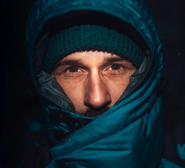 Portrait photo of a man in blue winter clothing