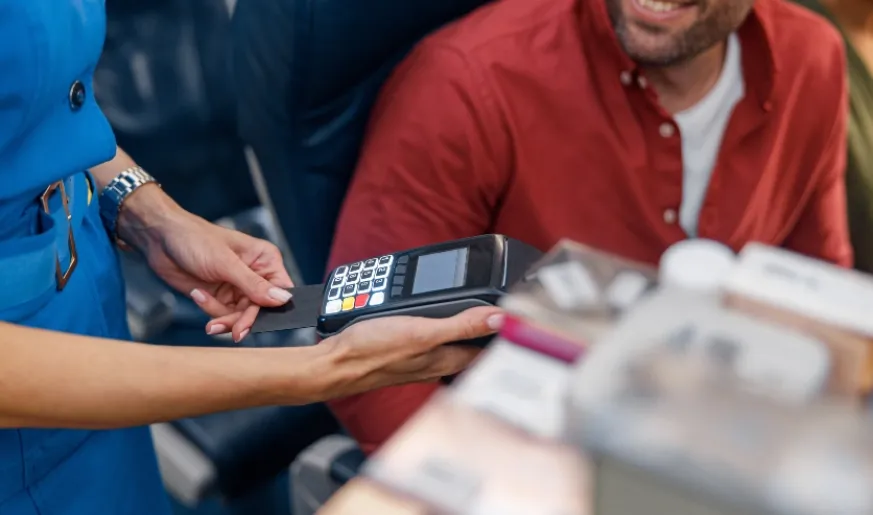 Photo of a commercial aviation passenger making payment