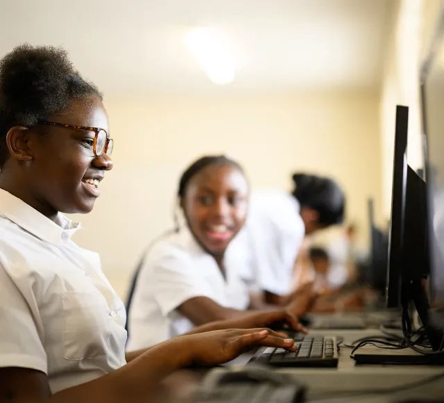 Photo of kids using their computers