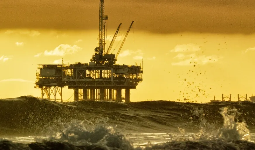 Photo of an offshore rig during sunrise