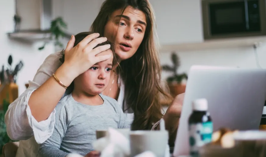 Photo of a mother with a patient child communicating through mobile video