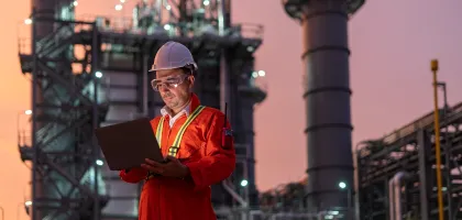 Photo of an employee working at an industrial site