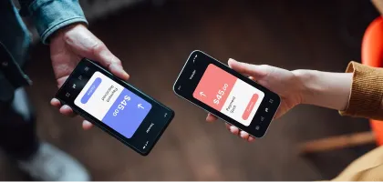 Photo of hands holding mobile phones for retail banking