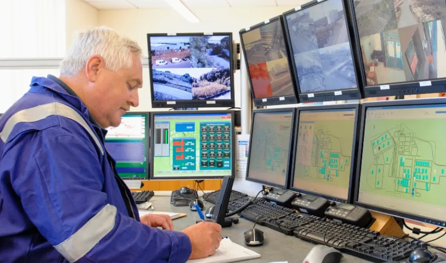 Photo of a transport engineer working in a control room