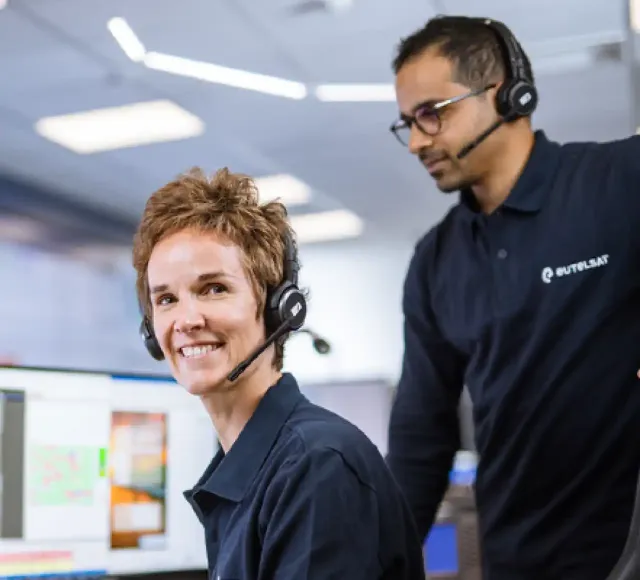 Two engineers working at monitors