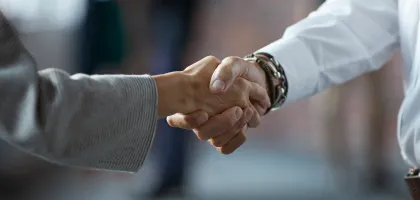 Photo of two hands in a handshake