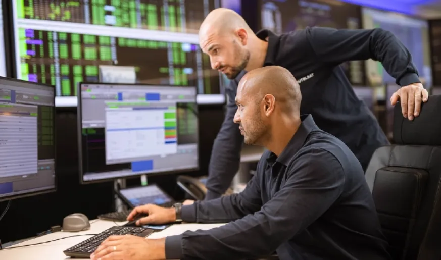 Photo of control center engineers in the control room of Eutelsat