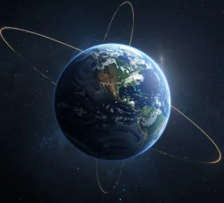 A view of the Earth from space with glowing orbital paths circling the planet against a dark background