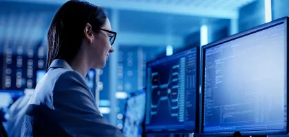 Close-up Shot of Female IT Engineer Working in Monitoring Room