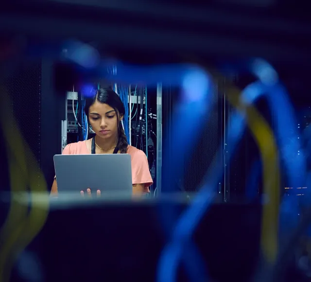 Photo of a woman in a data center