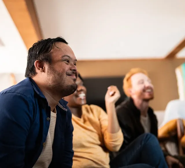 Photo of friends watching television