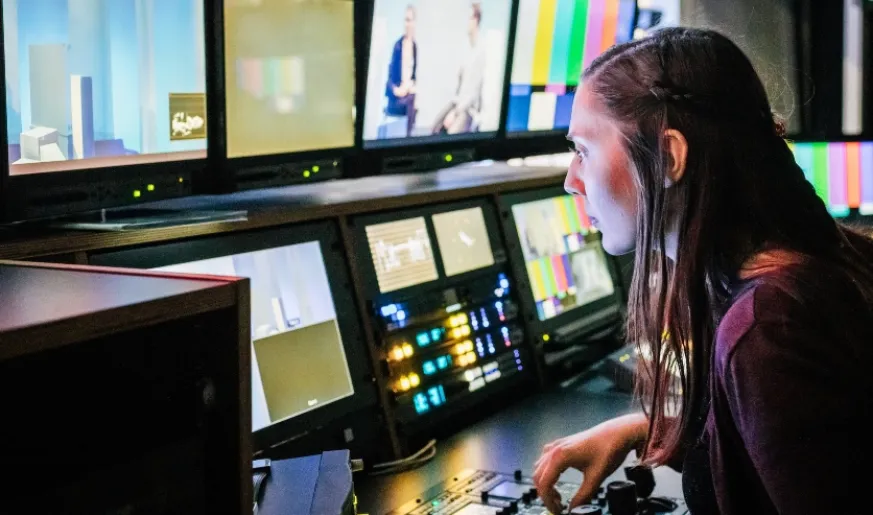 Photo of a media engineer in the control room