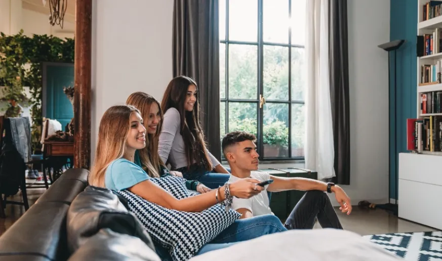 Photo of Young People Watching TV