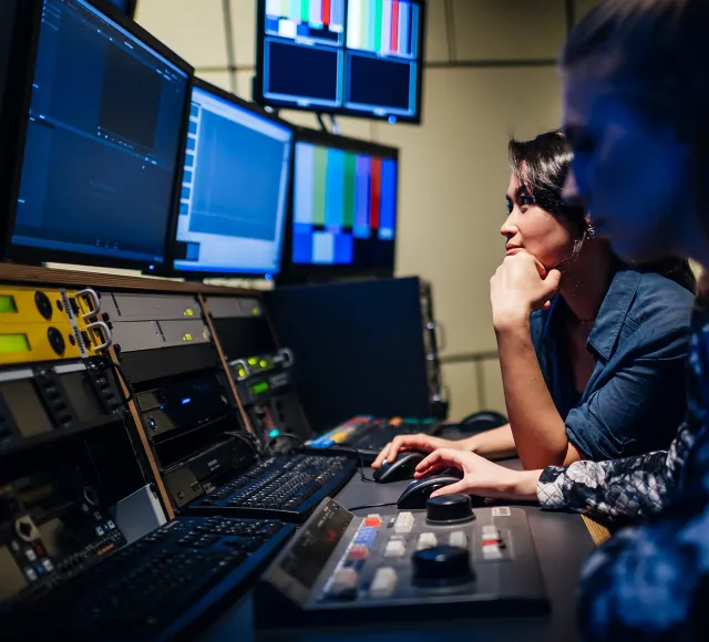 Photo of a woman editing at TV studio