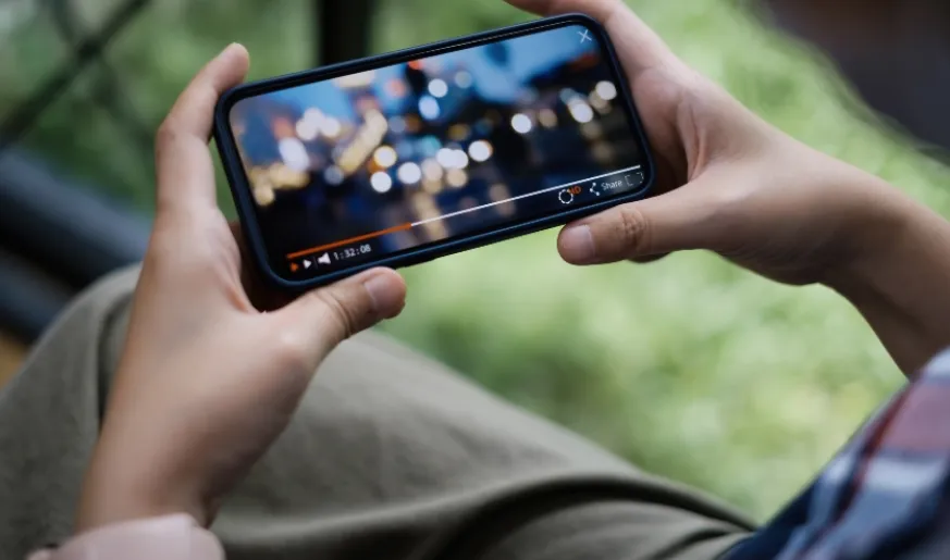 Photo of someone watching video on a phone