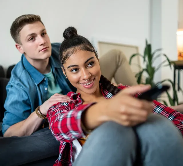 Photo of a couple watching TV