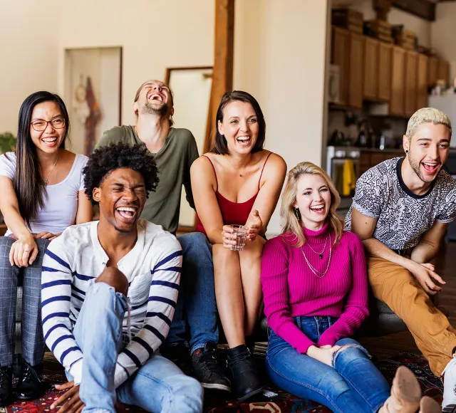 Photo of friends watching the television together