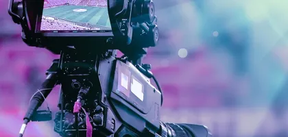 Photo of a camera filming an event